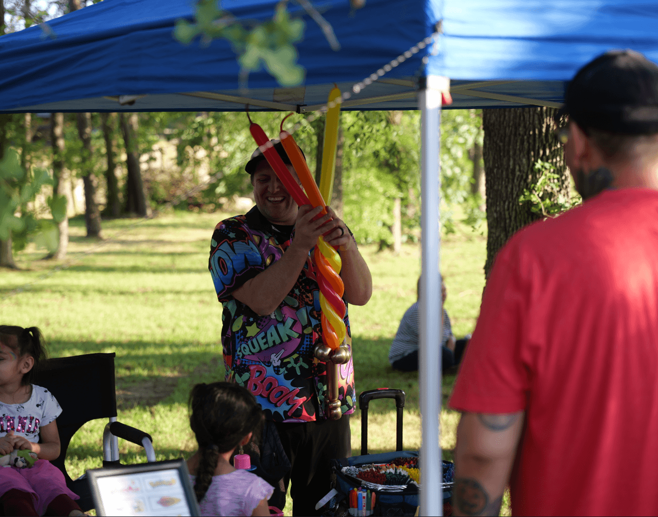 a man making balloon animals