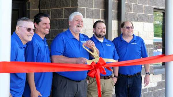 Spring Creek Utility Board members cut the ribbon at the new District building